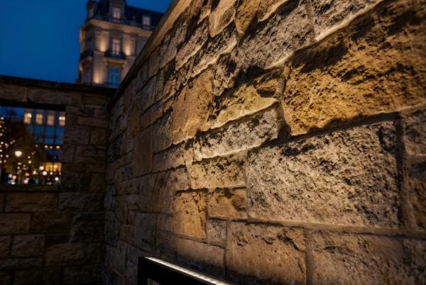 A wall being grazed by light, highlighting its stone texture
